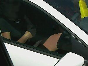 Pink panties in upskirt when she sits in car Picture 1