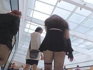 Upskirt of anime fan girl in fishnet stockings Picture 3