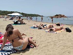 Hot pale girl suntanning on her first beach day Picture 3