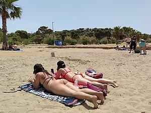 Hot pale girl suntanning on her first beach day Picture 6