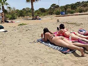 Hot pale girl suntanning on her first beach day Picture 7