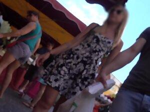 Upskirt of hot blonde while she walks through crowd Picture 7