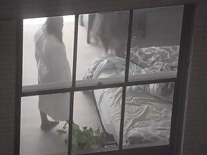 Peeping on naked neighbor interacting with her cat Picture 1