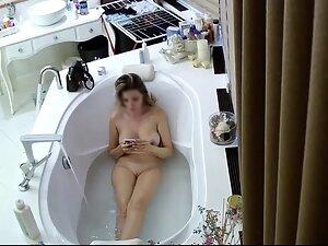 Spying on busty wife taking a bath Picture 3