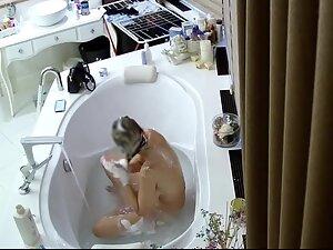 Spying on busty wife taking a bath Picture 5