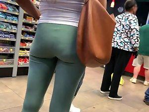 Inspection of black booty in greenish leggings Picture 1