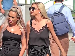Two busty bimbos in black and without bras