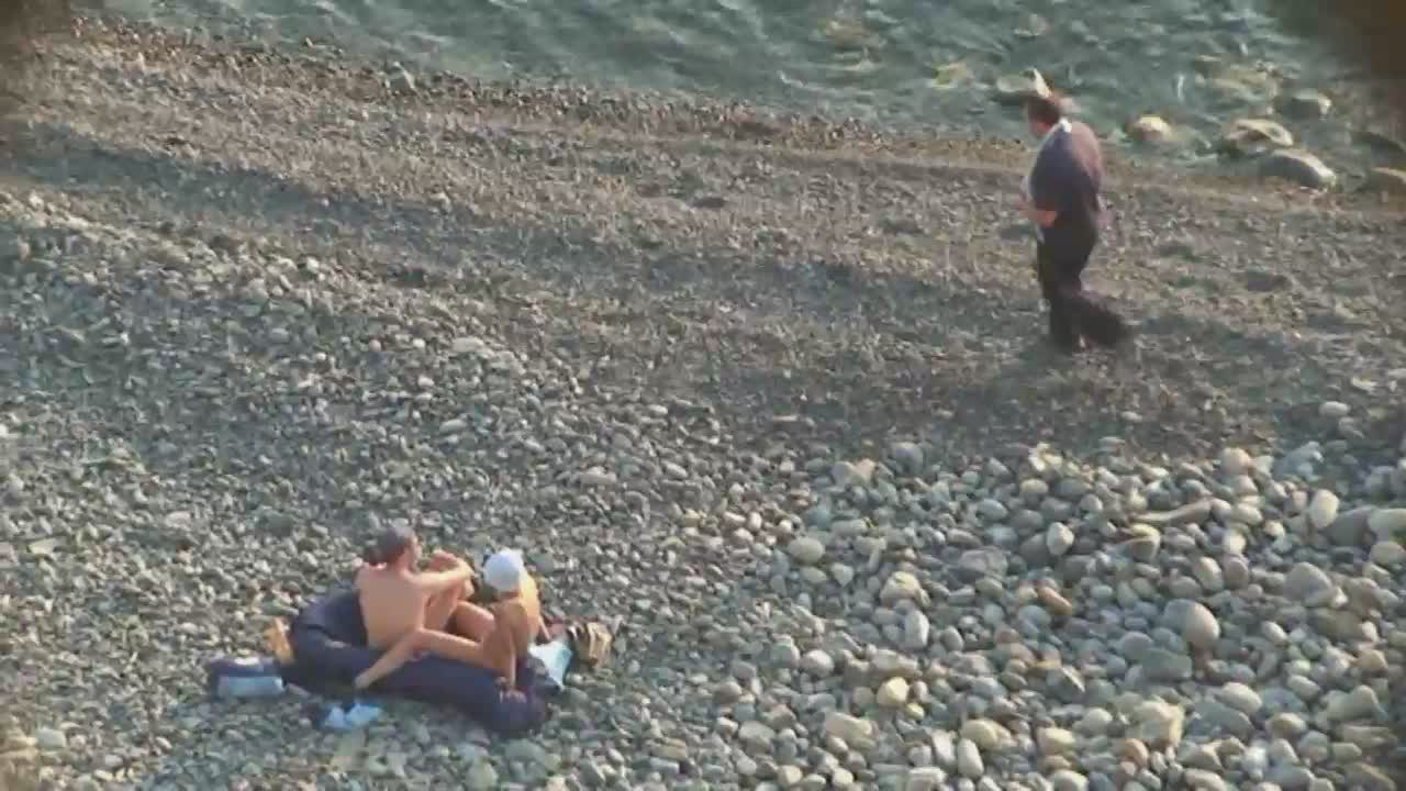 Beach oral sex in front of some people