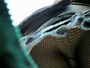Fishnet stockings seen in an upskirt