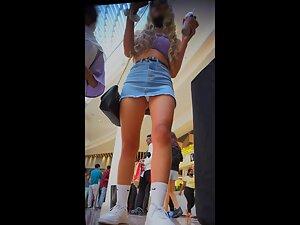 Slutty girl's miniskirt is just too short to cover her ass Picture 1