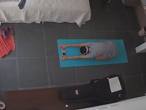 Spying on half naked milf doing yoga at home Picture 6