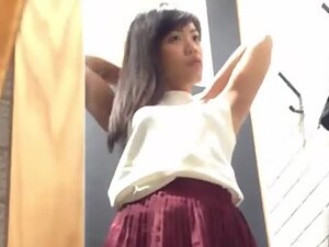 Cute asian girl spied while trying new blouses