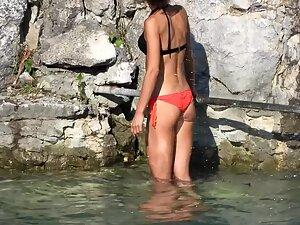 Fit tanned girl looks like a model in the water Picture 2