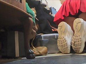 Upskirt of store clerk while she kneels down Picture 4
