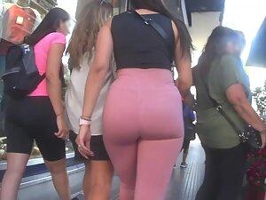 Soft big ass is squeezed in pink leggings